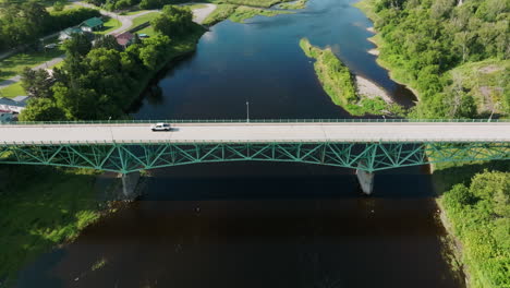 Aerial View Soars High Above Large Bridge in Maine&#039;s Peaceful Countryside
