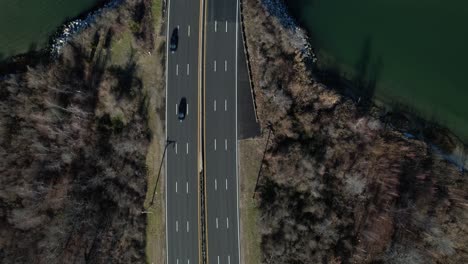 An-aerial-view-over-a-highway-on-Long-Island,-NY-on-a-sunny-day