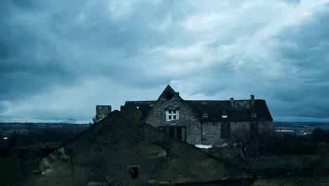 renovation of an abandoned mansion transforms it into a beautiful home under a dramatic, cloudy sky