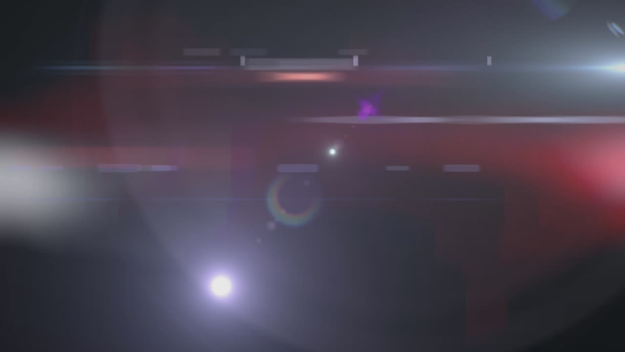 animación de un punto brillante con destello de la lente sobre un fondo rojo y negro