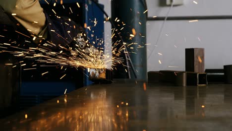 Welder-working-at-work-shop