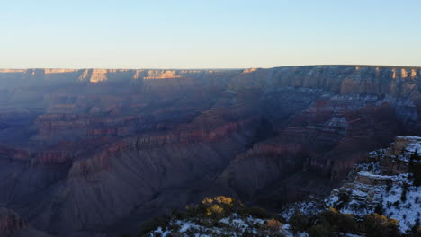 sunshine illuminating the mountain peak of grand canyon at shoshone point