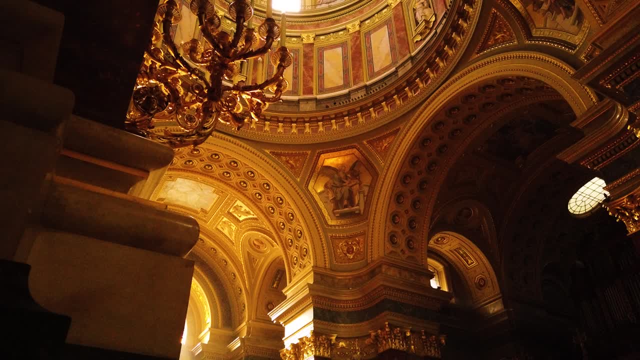 Interior of St. Stephen's Basilica (Szent Istvan Bazilika). Catholic Cathedral and one of the main attractions in Budapest in motion shot, revealing beautiful window