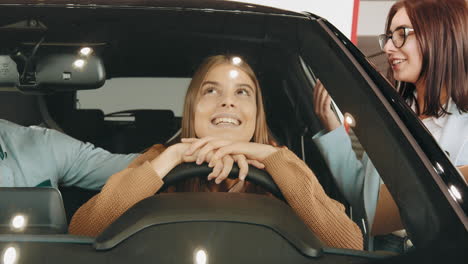 happy couple considering a new car