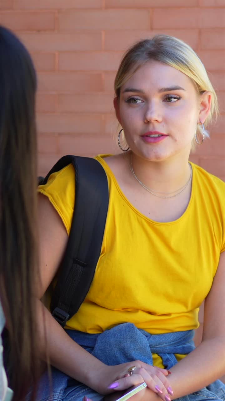 Two college students talking outdoors