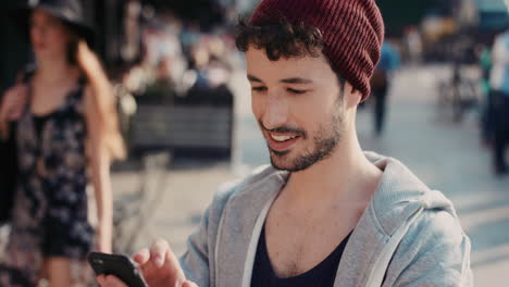 slow motion portrait of happy cute caucasian man using smart phone