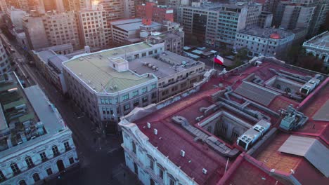 Establishing-aerial-view-orbiting-above-Santiago,-Chile,-Chamber-of-Deputies-red-rooftop-historical-building