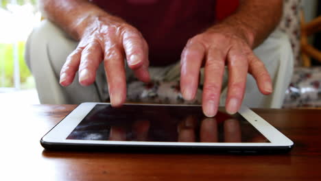 close up view of hands using tablet pc