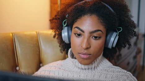 Relaxed-girl-checking-tablet-computer-email-evening.-Dark-skin-woman-reading