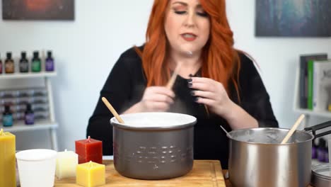 crafting fragrance: a step-by-step guide to candle making with melting wax and essential oils in a cozy home environment