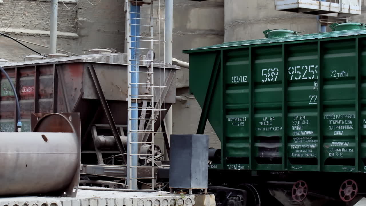 Exterior of concrete plant. Industrial equipment outdoors. Machinery on cement manufacturing factory. Industrial concept. Slow motion camera.