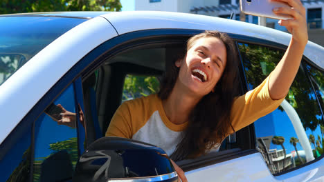 woman taking selfie in car 4k