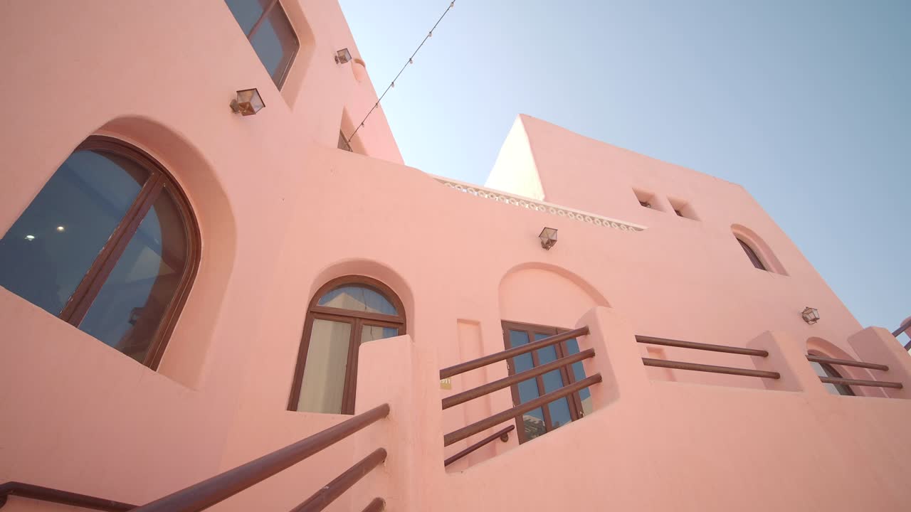 Pink building architecture with arched windows