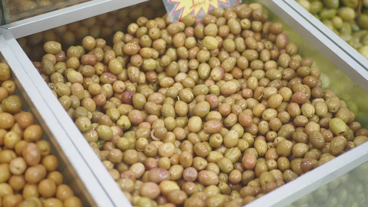 Green Olives in a Display Case