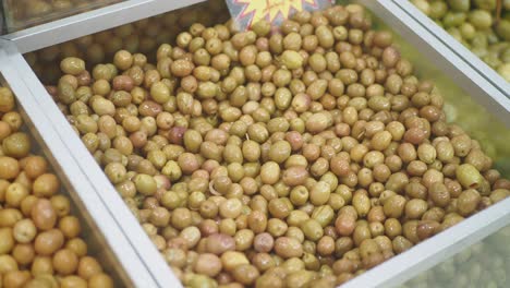 green olives in a display case