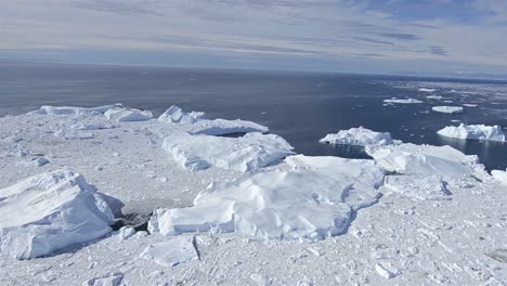 aerial of ice packed into the ilulissat icefjord below jakobshavn glacier or sermeq kujalleq near ilulissat greenland