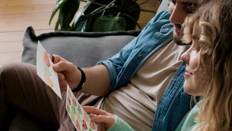 Man-and-woman-sitting-on-the-sofa