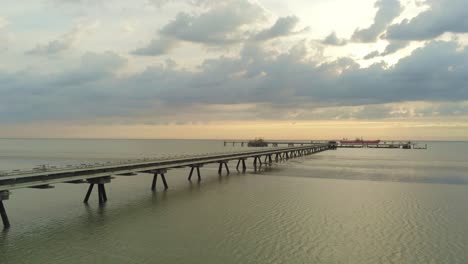 sunset above oil pier and north sea