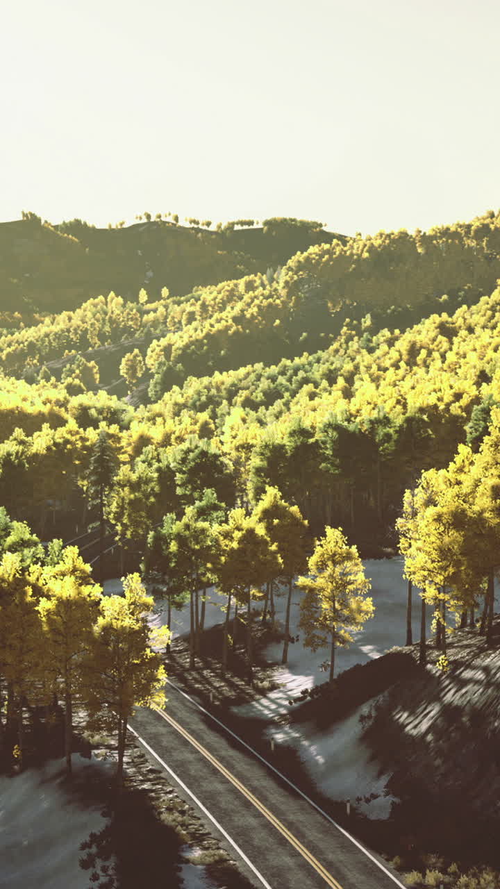 Scenic mountain landscape with golden trees and railway track nearby