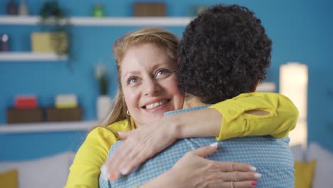 happy and proud mother hugging her son.