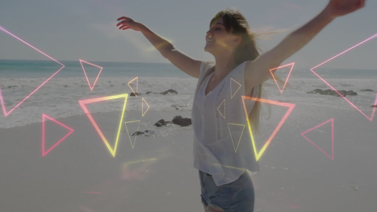 At beach, woman with colorful geometric shapes animation overlay, relaxing by water