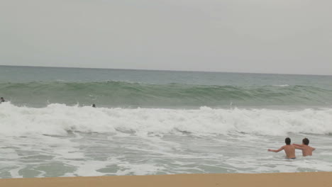 Teens-enjoying-the-waves