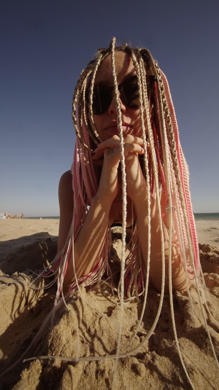Woman with braids on the beach