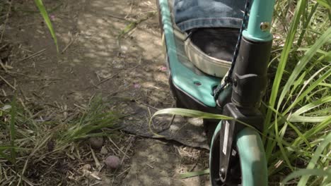taking a ride down a countryside path on a scooter