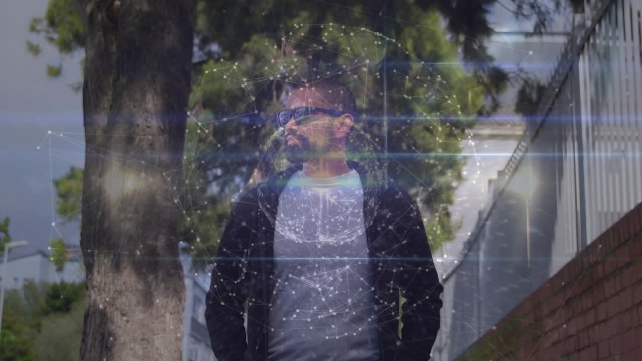 Man walking sidewalk and activating tech sphere appearing over torso while scanning surroundings
