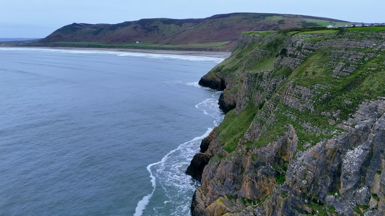 Worm’s Head where wild winds sweep, cliffs rise rugged, jagged and steep