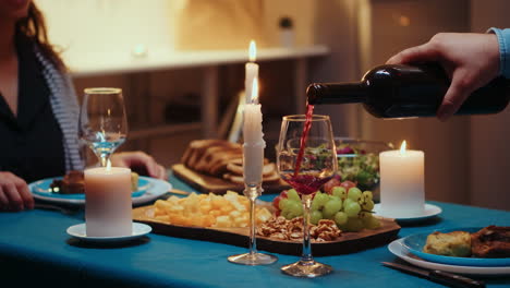 close up pouring wine in glass