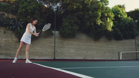 woman playing tennis on a court