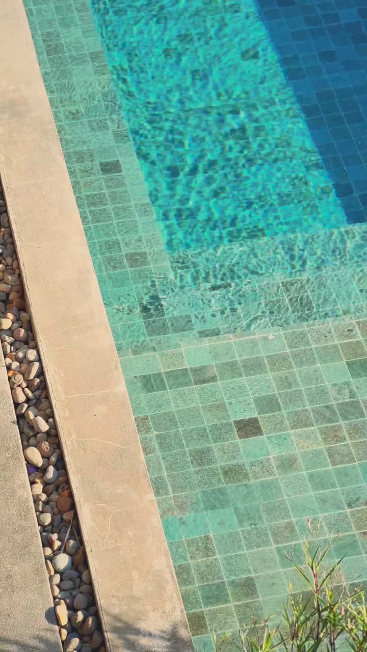 Video shot of the pool with turquoise mosaics