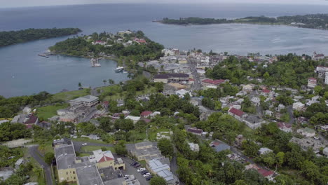 aerial view of port antonio in jamaica showing the west harbour and panning around to view navy island and the east harbour taking in port antonio town