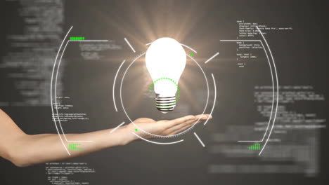 Animation of scope scanning and data processing over hand holding light bulb on black background