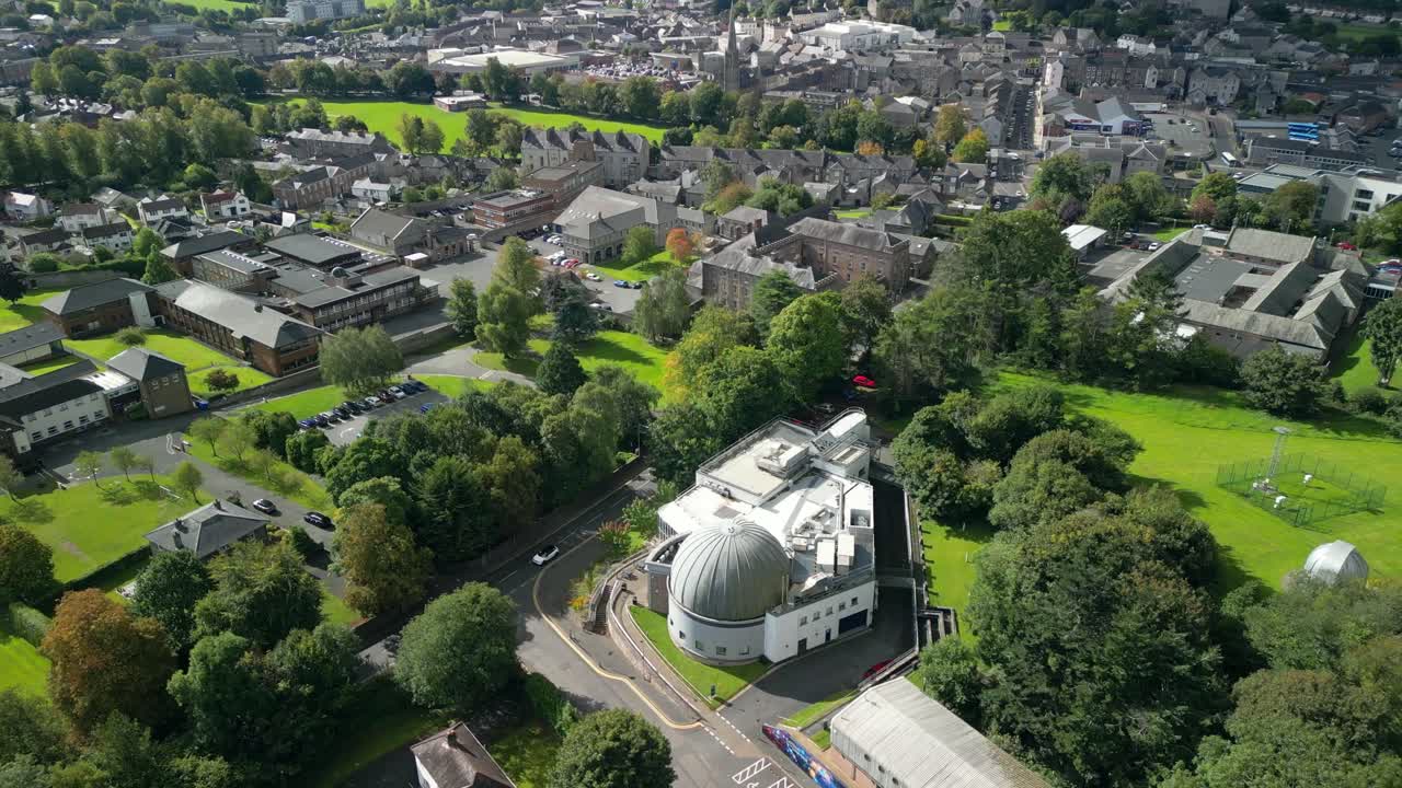 Clockwise rotating 4K 30FPS aerial video of Armagh Planetarium and the surrounding area in Armagh, Northern Ireland in the UK. Produced in Rec709 color