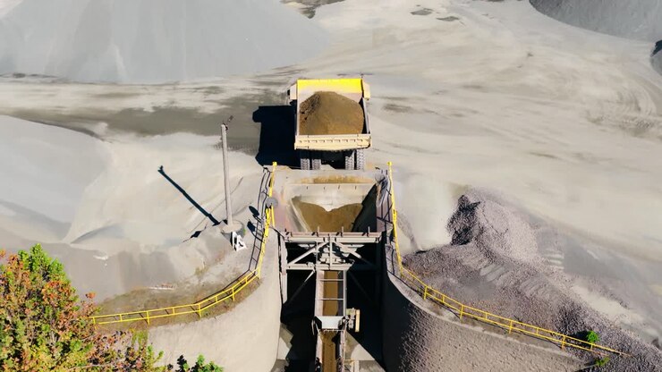 Heavy Duty Mining Machine To Break Down Raw Materials At Martin Marietta - Jones Mill Quarry In Arkansas, USA. Aerial Pullback Shot