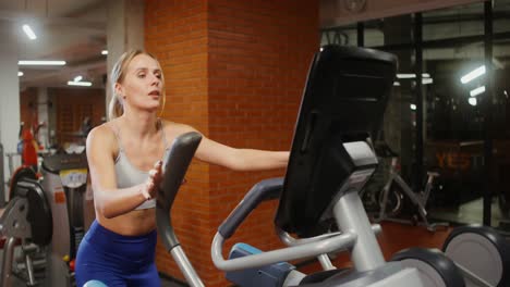 woman exercising on an exercise bike in a gym