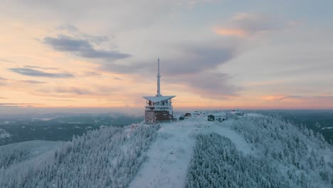 Lysa-hora-during-winter-sunrise,-Pan-up-and-descending-drone,-Beskydy-UHD
