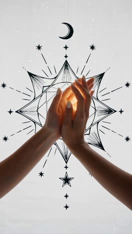 hands holding light with moon and stars