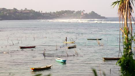 fisherman and his boat, bali coast