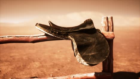 horse saddle on the fence in monument valley