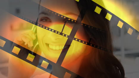 talking on smartphone, smiling woman with film reel animation overlay