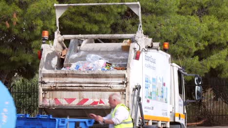 rubbish truck crushing rubbish