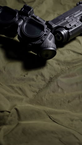 military equipment and tactical gear on camouflage fabric