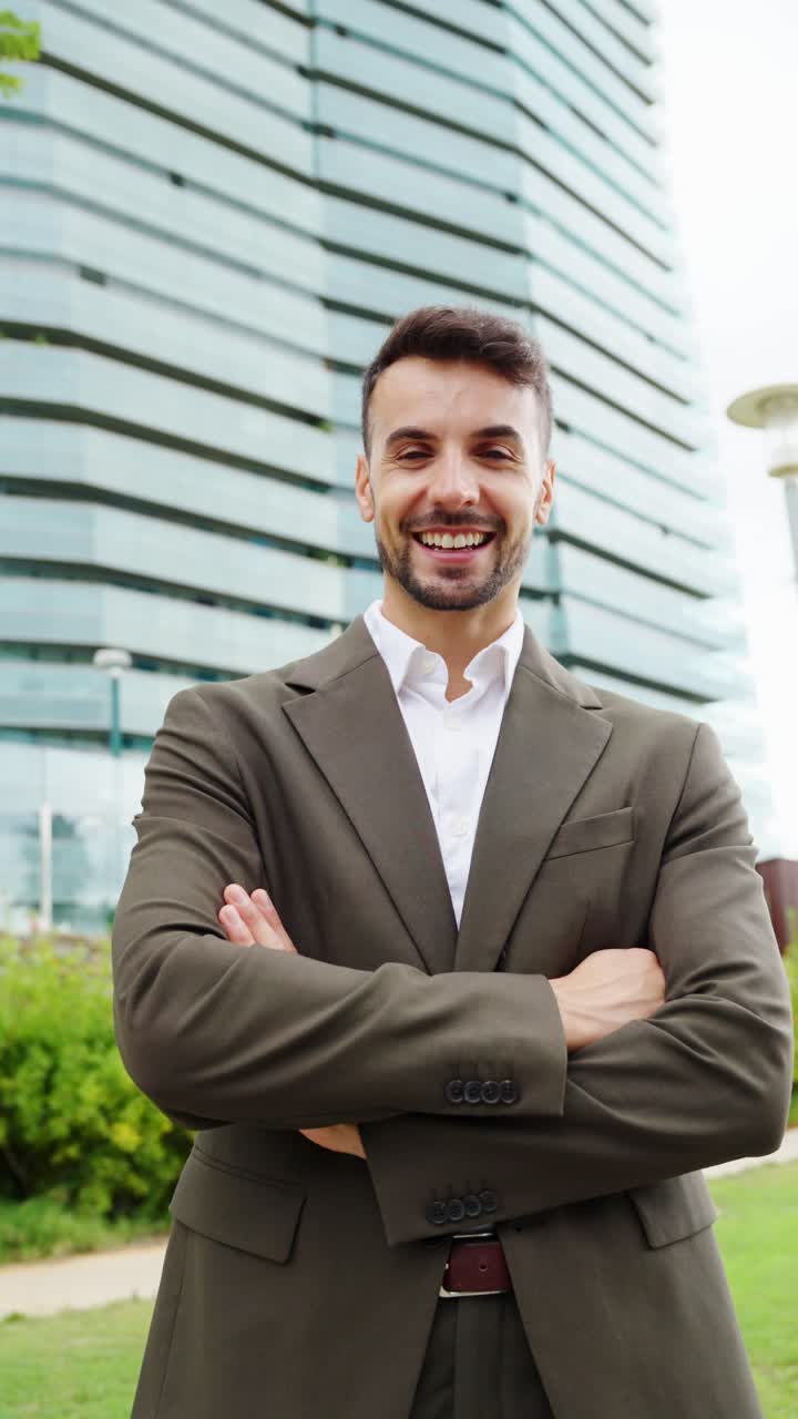 A confident businessman in front of a modern office building