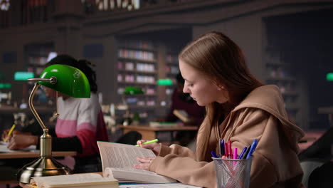 vertical video young student focusing on highlighting important ideas and information
