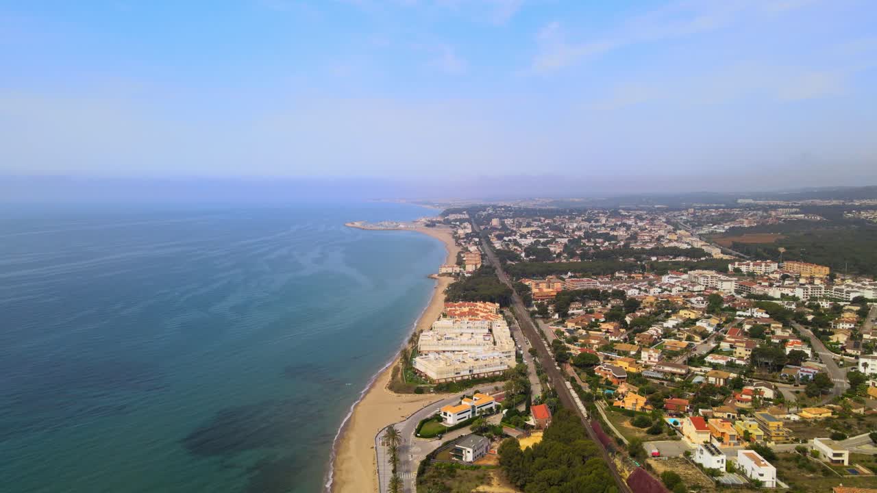 Aerial 4K drone footage of blooming Coma-Ruga in spring, showcasing vibrant trees in different stages of bloom, a picturesque display of nature's rejuvenation