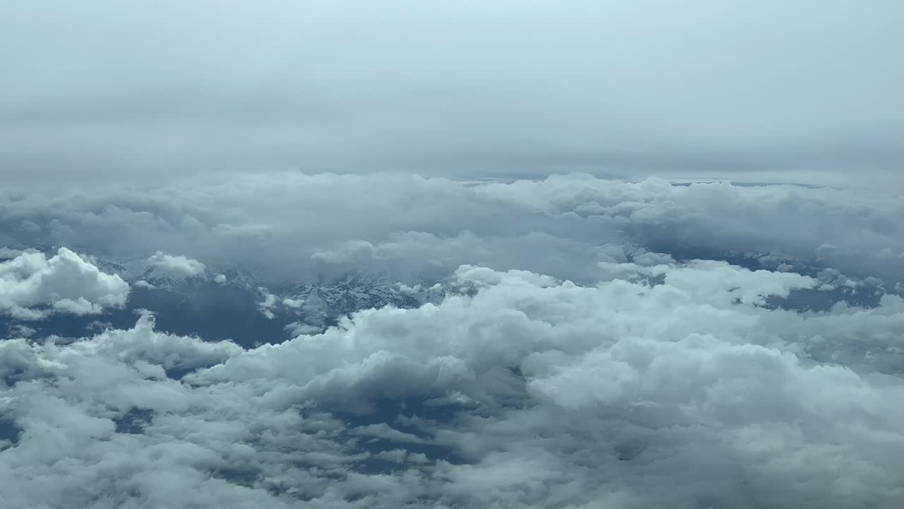 Immersive Pilot POV flying across a snowed mountainous landscape shot from a jet cabin