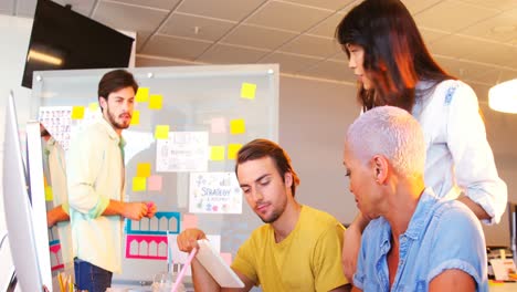 creative business team working together at desk